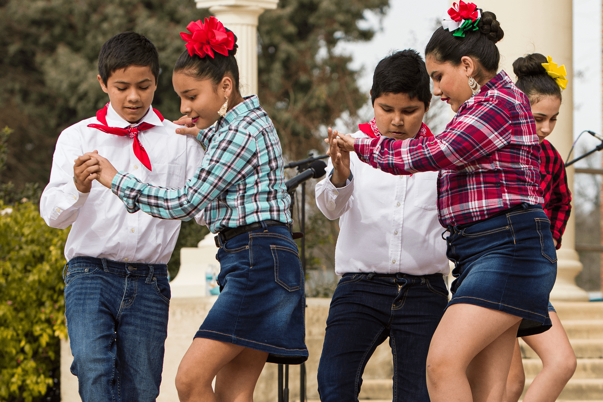 Image of young Folkloric Dancers in western fashion dancing in front of Atascadero City Hall - Photo by Keith Bergher